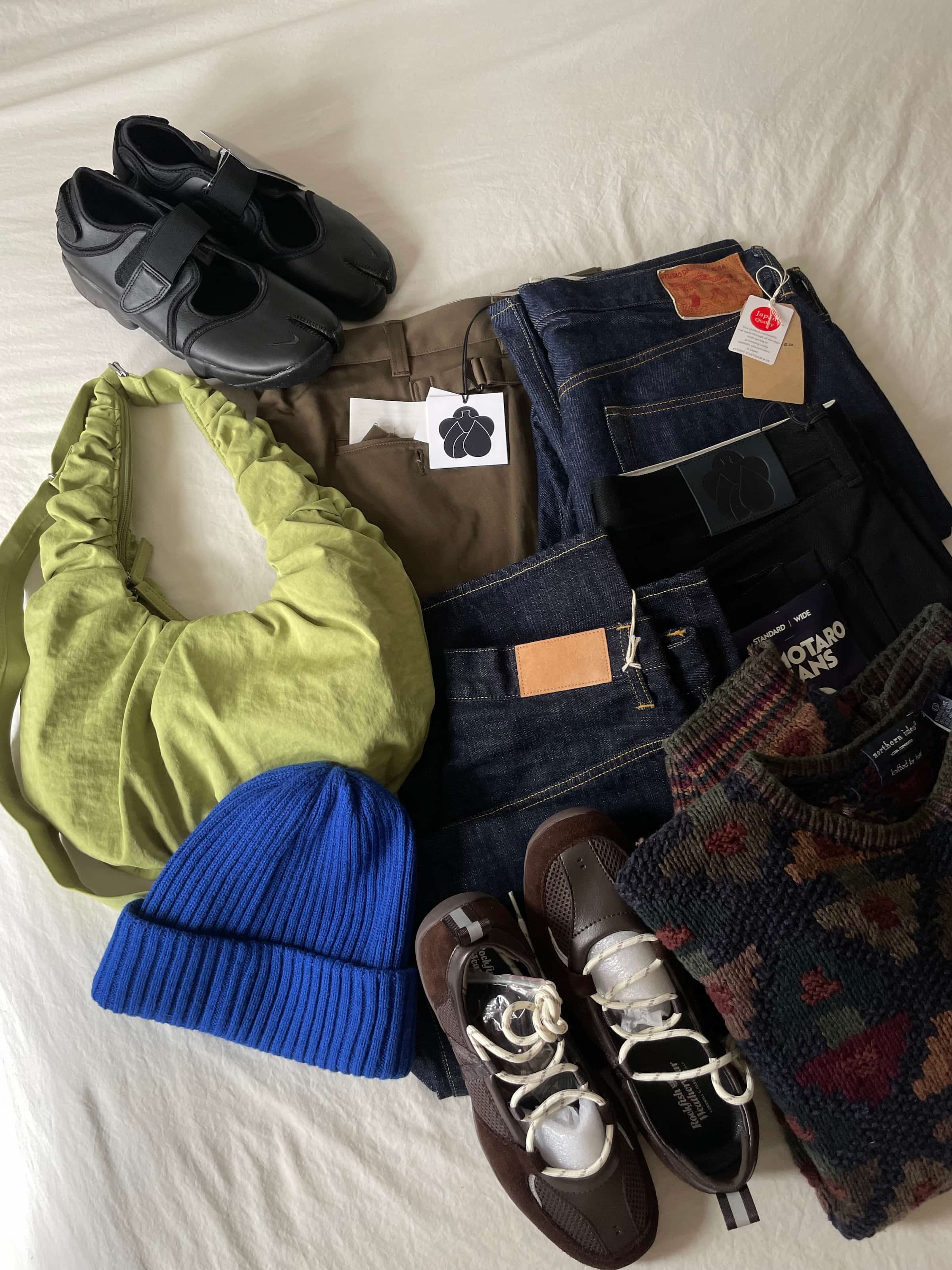 A pile of clothing and shoes.